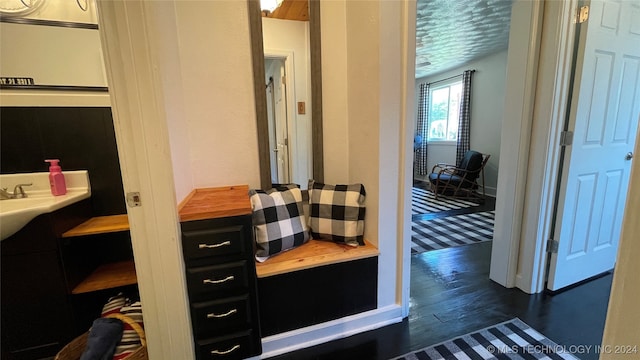 bathroom with hardwood / wood-style flooring