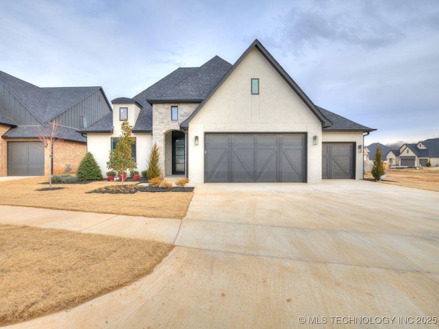 french country style house featuring a garage