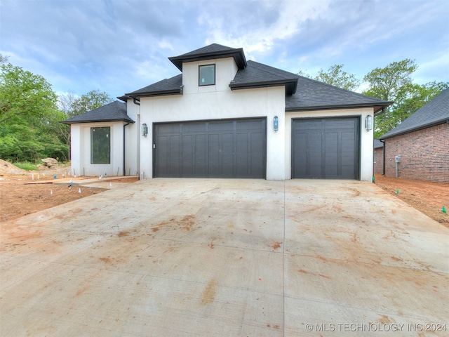 view of front of property with a garage