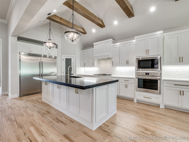 kitchen featuring beam ceiling, built in appliances, backsplash, and white cabinets