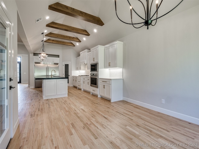 kitchen featuring sink, white cabinets, stainless steel appliances, and light wood-type flooring