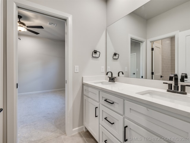 bathroom featuring tile patterned floors, ceiling fan, and vanity