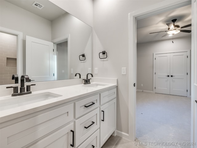 bathroom with ceiling fan, vanity, and concrete floors