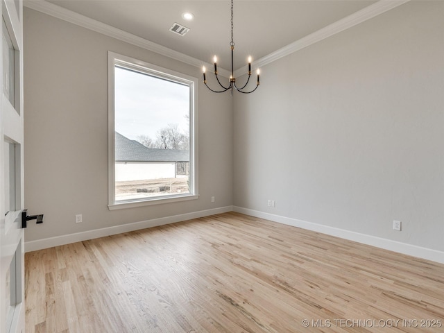 spare room with an inviting chandelier, crown molding, and light wood-type flooring