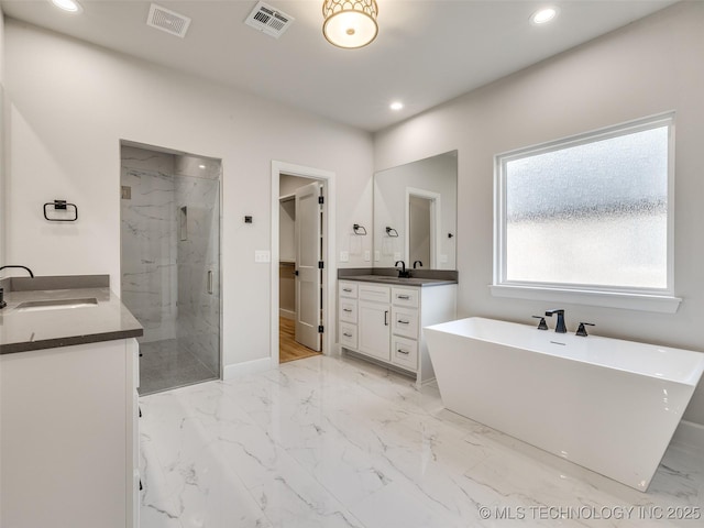 bathroom featuring plus walk in shower and vanity