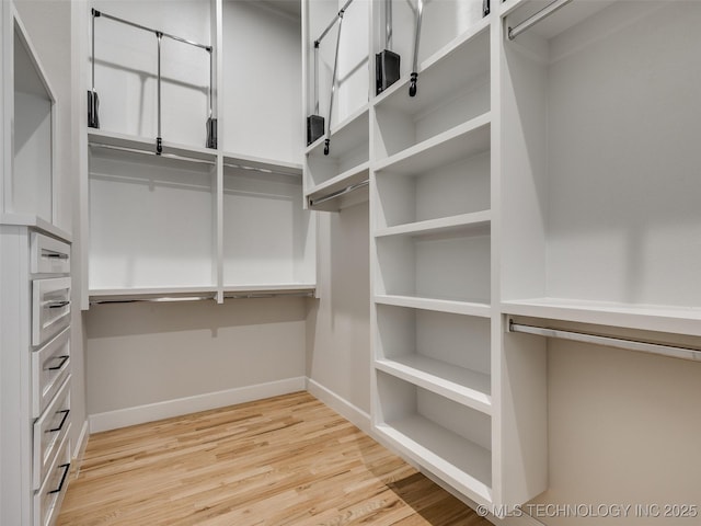 walk in closet featuring light wood-type flooring