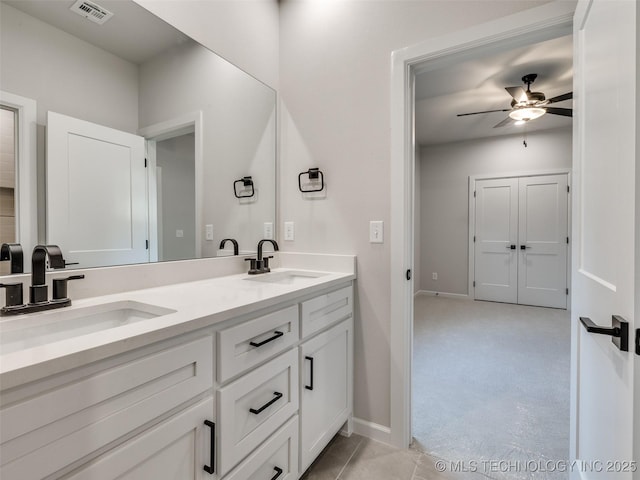 bathroom featuring vanity and ceiling fan