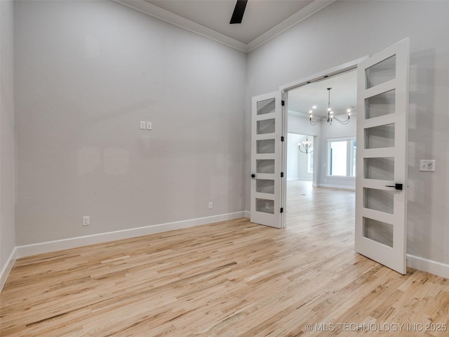 unfurnished room with crown molding, light hardwood / wood-style flooring, and ceiling fan with notable chandelier