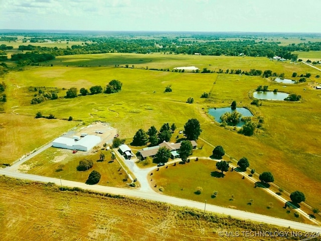 aerial view with a water view and a rural view