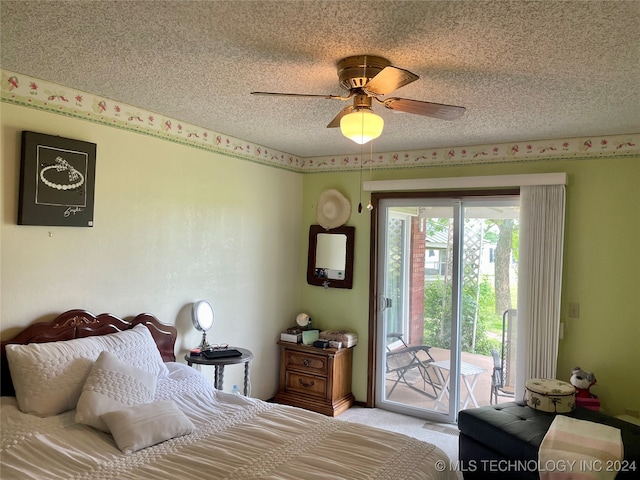 carpeted bedroom featuring a textured ceiling, access to outside, and ceiling fan