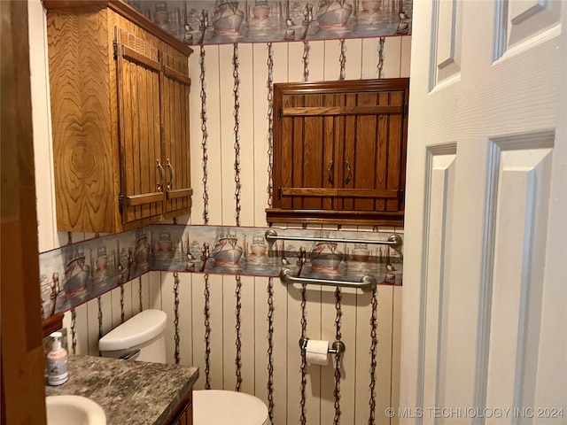 bathroom featuring toilet and vanity