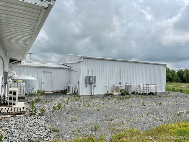 view of outbuilding featuring ac unit