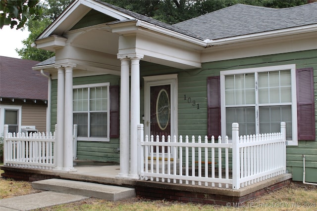 doorway to property featuring covered porch