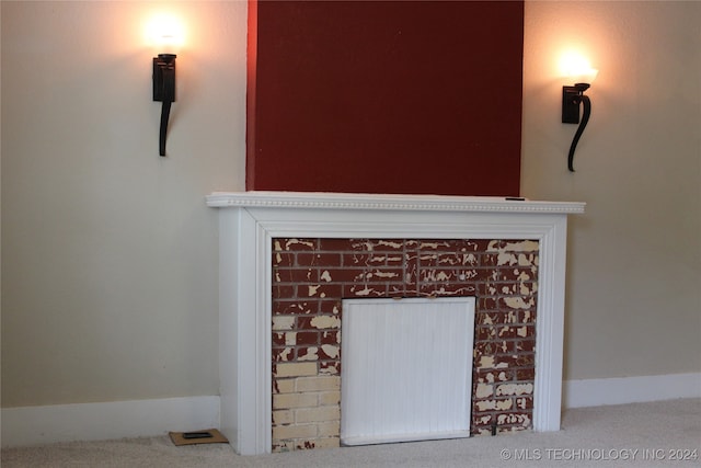 interior details with carpet and a fireplace