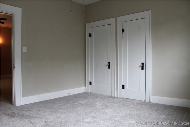 unfurnished bedroom with carpet