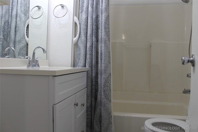 bathroom featuring toilet, crown molding, shower / bathtub combination with curtain, and vanity