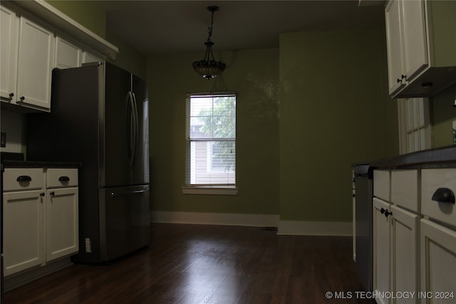 kitchen with dark countertops, dark wood-style floors, baseboards, and white cabinets