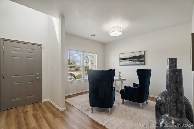 sitting room with light hardwood / wood-style floors