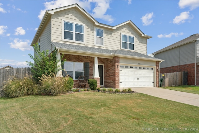 view of front of house with a garage and a front yard