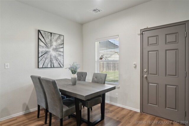 dining space featuring hardwood / wood-style floors and a wealth of natural light