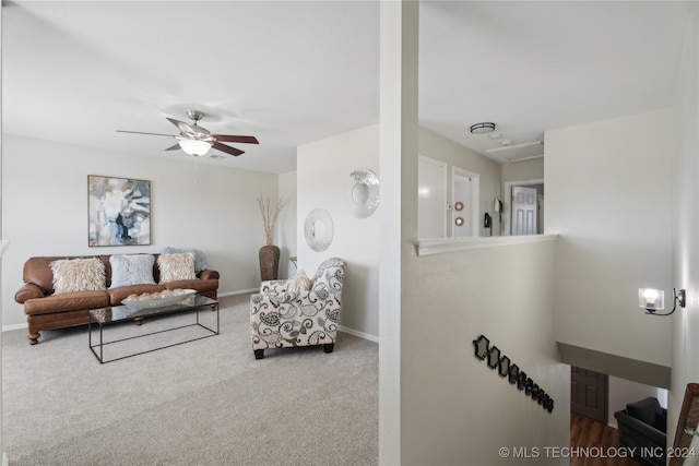 carpeted living room featuring ceiling fan