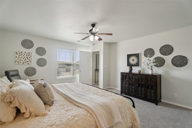 carpeted bedroom with ceiling fan