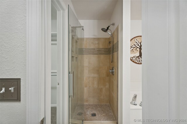 bathroom with an enclosed shower