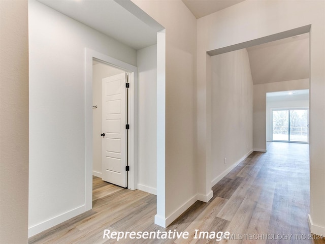 corridor featuring light hardwood / wood-style floors