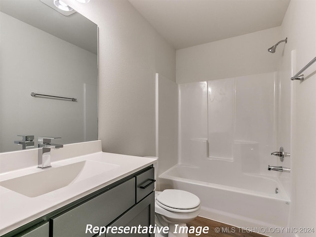 full bathroom featuring vanity, toilet, and shower / washtub combination