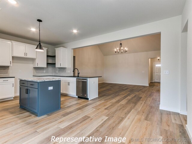 kitchen with dishwasher, light hardwood / wood-style flooring, white cabinetry, and decorative light fixtures