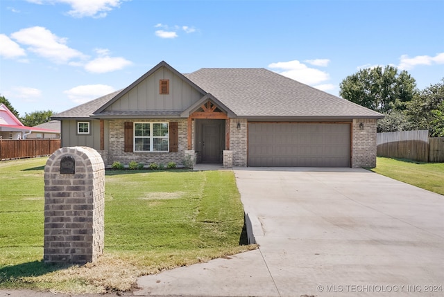 view of front facade featuring a front lawn and a garage