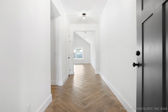 hallway featuring light parquet floors and crown molding