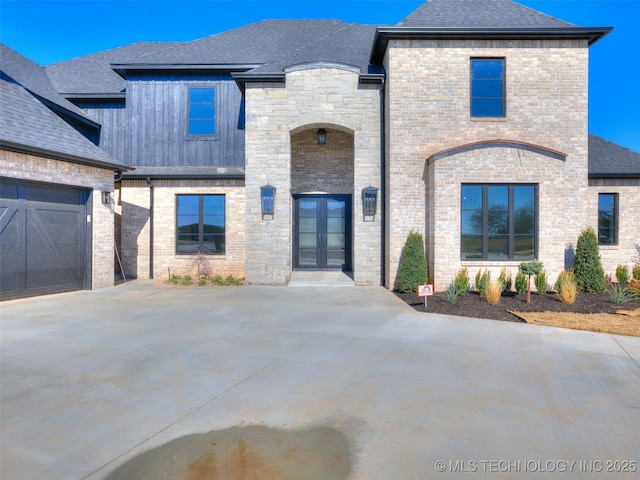 french country inspired facade featuring french doors