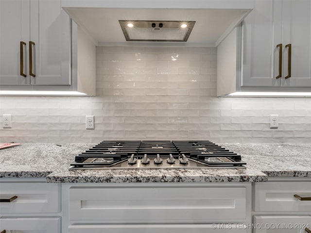 4008 W Yuma St S, Broken Arrow, OK 74011 - kitchen with stainless steel gas stovetop, tasteful backsplash, and light stone countertops