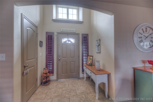 entryway featuring light tile patterned flooring