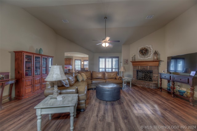 living room with high vaulted ceiling, ceiling fan, a fireplace, and dark hardwood / wood-style flooring