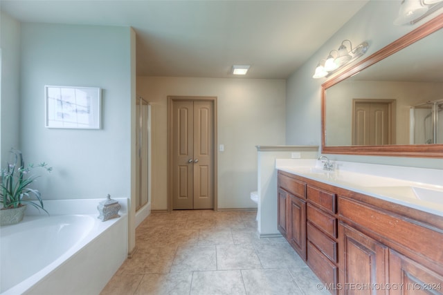 full bathroom featuring vanity, toilet, independent shower and bath, and tile patterned floors