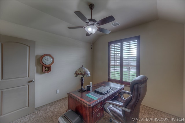 carpeted office space featuring lofted ceiling and ceiling fan