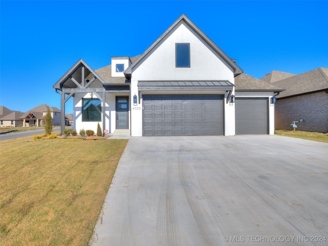 view of front facade featuring a front yard and a garage