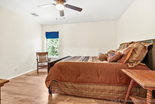 bedroom with light wood-type flooring and ceiling fan