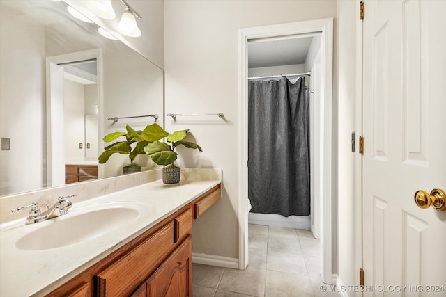 bathroom featuring a shower with curtain, vanity, and tile patterned floors