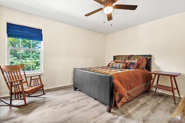 bedroom featuring ceiling fan and light wood-type flooring