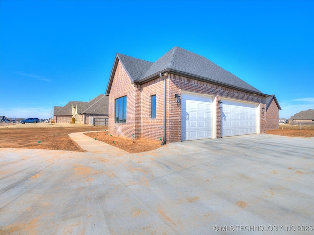 view of side of property featuring a garage