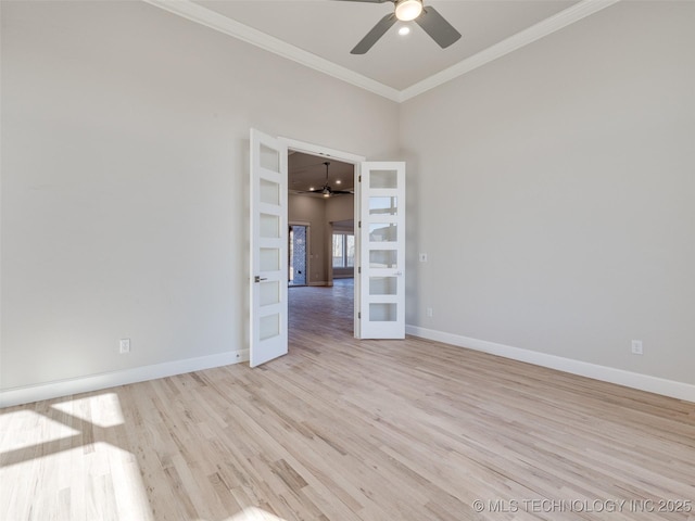 spare room with ornamental molding, french doors, ceiling fan, and light wood-type flooring