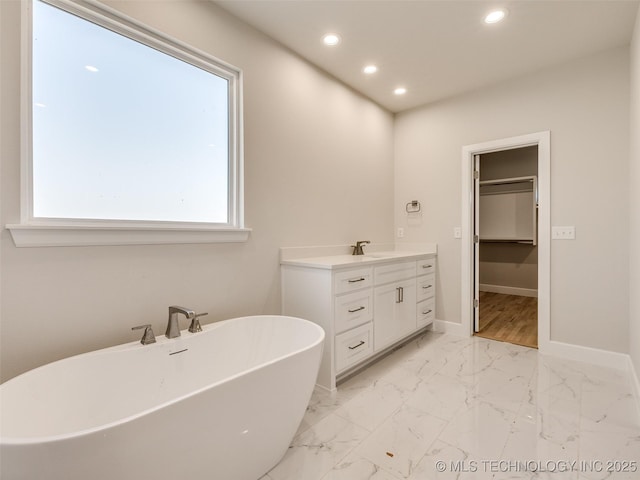 bathroom featuring vanity and a bathing tub