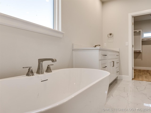 bathroom featuring vanity and a bathtub