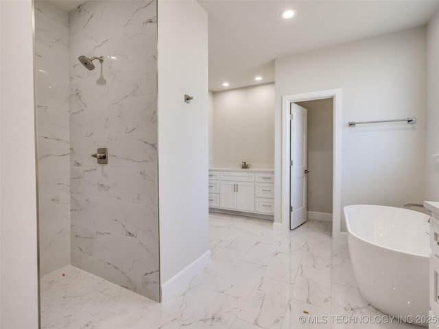 bathroom with vanity and shower with separate bathtub