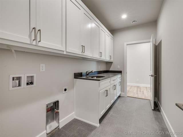 laundry room with cabinets, washer hookup, sink, and electric dryer hookup