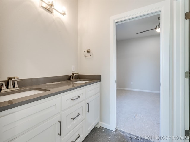 bathroom featuring ceiling fan and vanity