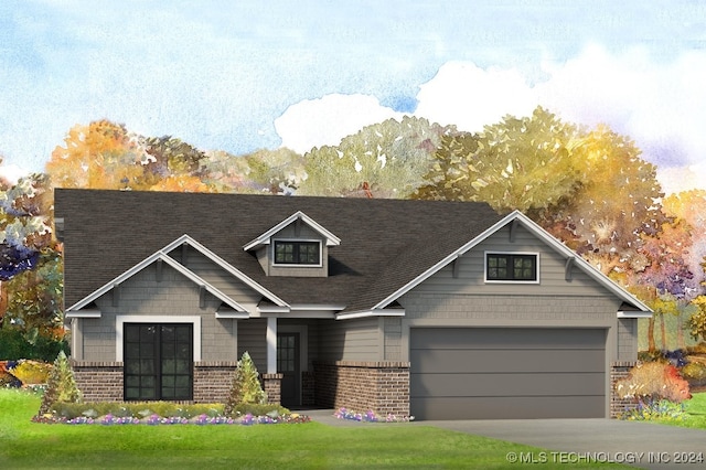 view of front of home with a garage and a front lawn